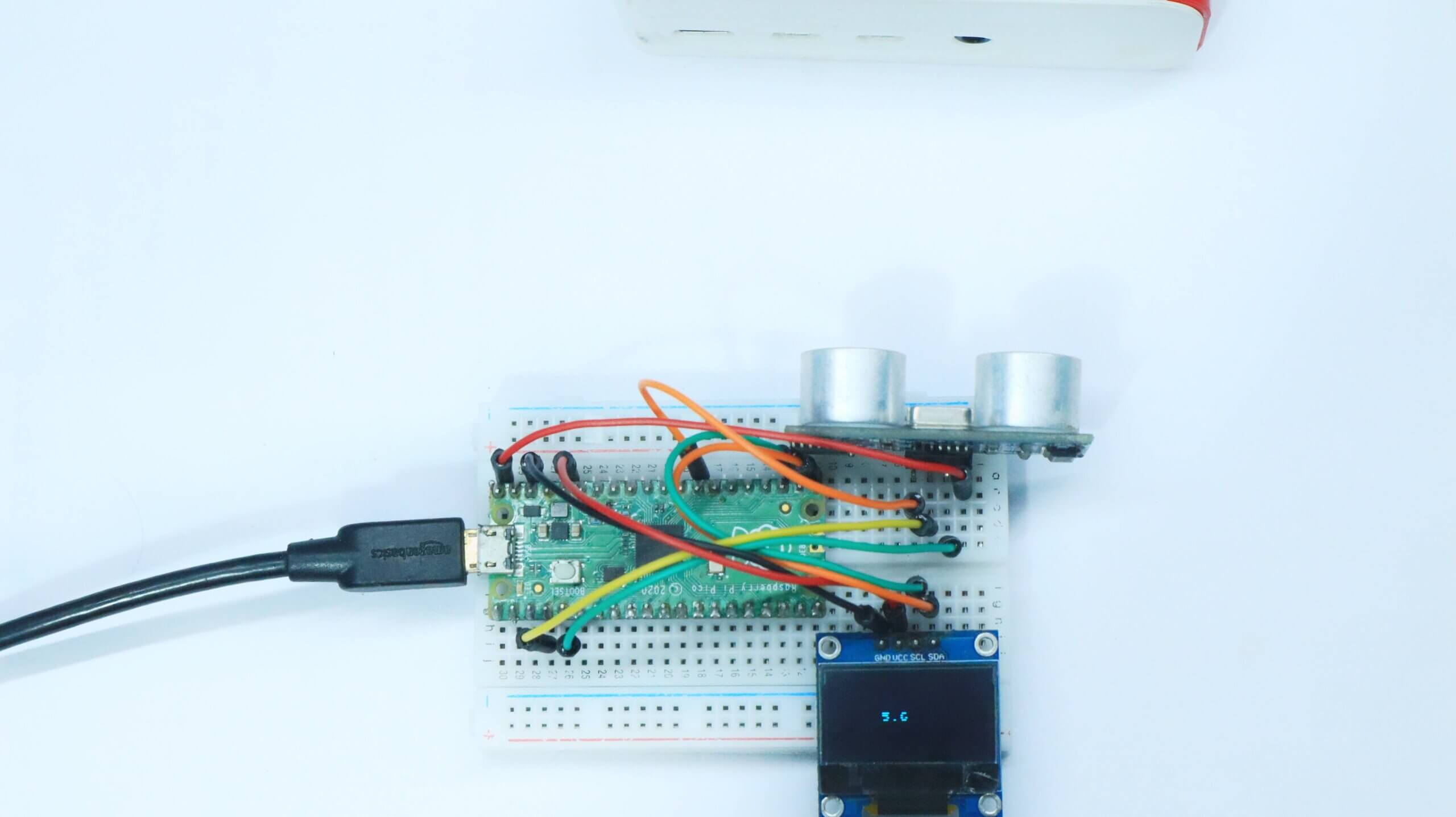 Distance measures With ultrasonic sensor, ssd1306 and Raspberry pi pico